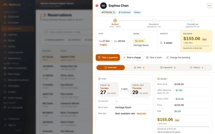 A booking opened at the side: stay, room, guests, the balance, and buttons to take a payment or post a charge